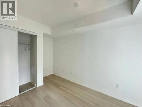 Neutral white walls complemented by light wood-finish flooring - 500 Wilson Avenue Unit# 614, Toronto, ON - Indoor Photo Showing Other Room