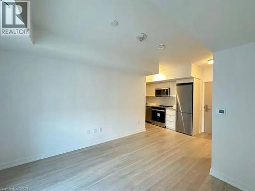 Open-concept living area with light wood-finish flooring - 500 Wilson Avenue Unit# 614, Toronto, ON - Indoor Photo Showing Kitchen