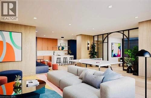 Open-concept living space featuring wood-finish flooring and recessed lighting - 4878 Powers Common Unit# 301, Burlington, ON - Indoor