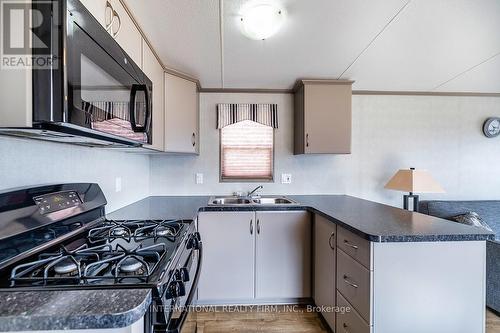 1235 Villiers Line - 34 Glen Abbey, Otonabee-South Monaghan, ON - Indoor Photo Showing Kitchen With Double Sink