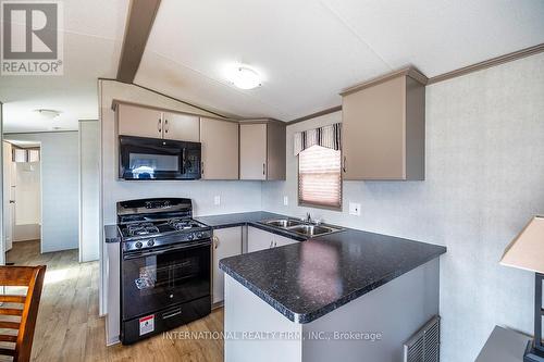 1235 Villiers Line - 34 Glen Abbey, Otonabee-South Monaghan, ON - Indoor Photo Showing Kitchen With Double Sink