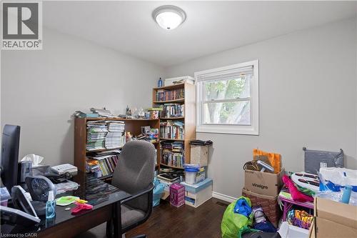 Room featuring wood-finish flooring, a double-hung window with white trim, a flush-mount ceiling light fixture, and light gray painted walls - 179 Vancouver Street, London, ON - Indoor Photo Showing Office