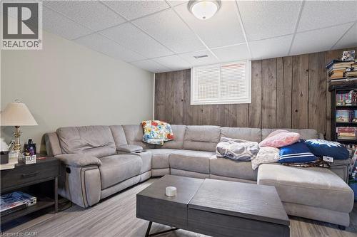 Finished room featuring wood-finish flooring and a drop ceiling - 179 Vancouver Street, London, ON - Indoor Photo Showing Living Room