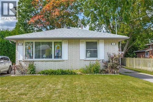 White brick facade with a light grey shingle roof - 179 Vancouver Street, London, ON - Outdoor