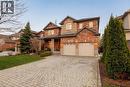 Brick and stone façade residence with a two-car garage - 129 Magnificent Way, Binbrook, ON  - Outdoor 