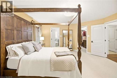Spacious bedroom featuring light-toned carpeting and warm wall tones - 129 Magnificent Way, Binbrook, ON - Indoor Photo Showing Bedroom