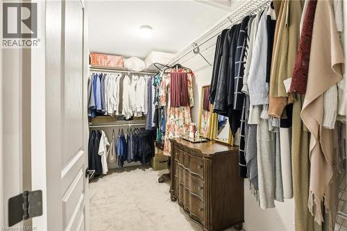 Spacious walk-in closet featuring wire shelving, multiple hanging rods, and recessed lighting - 129 Magnificent Way, Binbrook, ON - Indoor With Storage