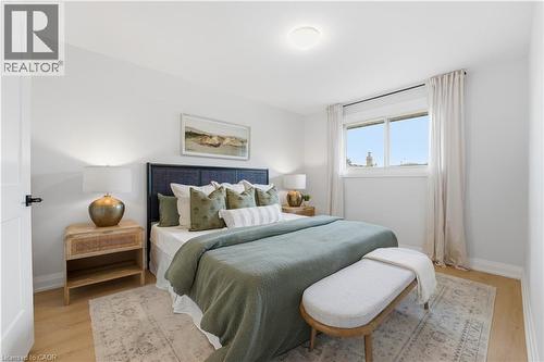 Bedroom featuring wood-finish flooring, white walls, and a recessed ceiling light - 11 Marcella Crescent, Hamilton, ON - Indoor Photo Showing Bedroom