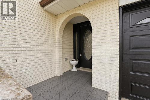 Arched entryway featuring light-colored brick exterior - 11 Marcella Crescent, Hamilton, ON - Outdoor With Exterior