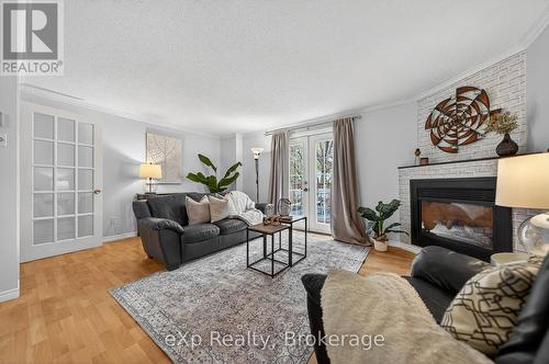 111 Connelly Drive, Kitchener, ON - Indoor Photo Showing Living Room With Fireplace