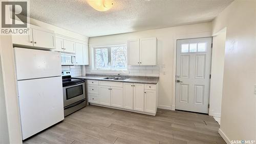 201 V Avenue N, Saskatoon, SK - Indoor Photo Showing Kitchen With Double Sink
