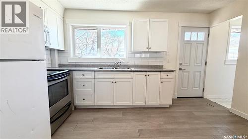 201 V Avenue N, Saskatoon, SK - Indoor Photo Showing Kitchen With Double Sink