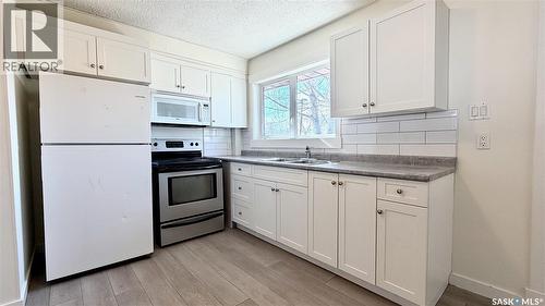 201 V Avenue N, Saskatoon, SK - Indoor Photo Showing Kitchen With Double Sink