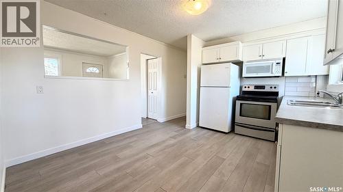 201 V Avenue N, Saskatoon, SK - Indoor Photo Showing Kitchen With Double Sink