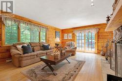 Living room hardwood floor and big windows - 