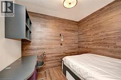 Accent wall featuring wood-finish paneling - 