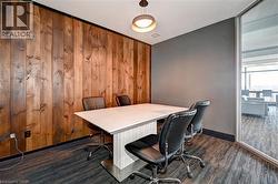 Accent wood-paneled wall and gray painted walls - 