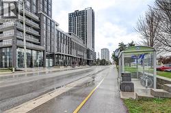 Modern urban development featuring multi-story buildings with glass facades and residential balconies - 