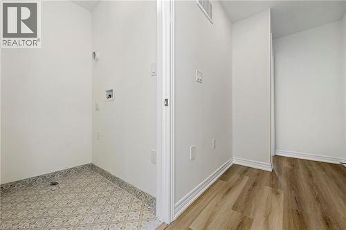 Upper level laundry with Euro-style tiles - 205 Thames Way Unit# 31, Hamilton, ON - Indoor Photo Showing Other Room