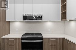 Kitchen. Photos may be of a similar home in the condo community. - 