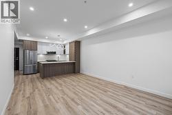 Kitchen, Dining & Living. Photos may be of a similar home in the condo community. - 