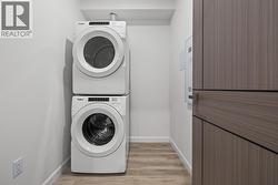 Laundry. Photos may be of a similar home in the condo community. - 