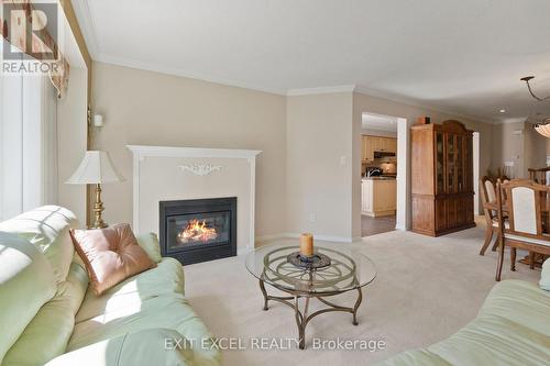 67 Hawktree, Ottawa, ON - Indoor Photo Showing Living Room With Fireplace