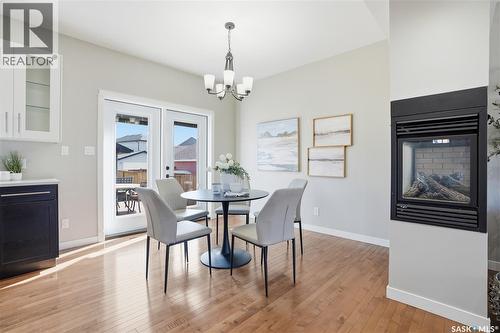 210 Padget Crescent, Saskatoon, SK - Indoor Photo Showing Dining Room With Fireplace