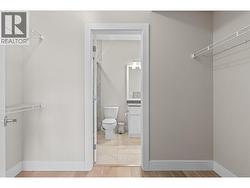 Primary walk-through closet with built ins - 