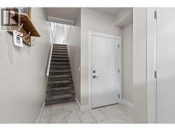 Carpeted stairs to main floor - 