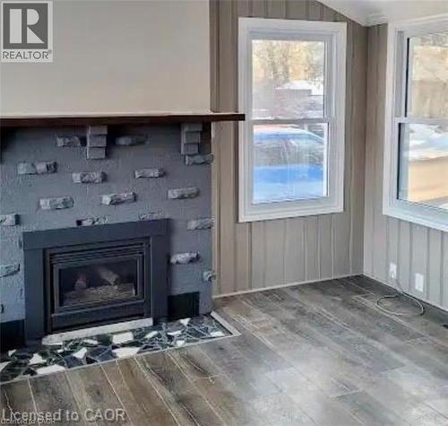 96 Orchard Avenue, Simcoe, ON - Indoor Photo Showing Living Room With Fireplace