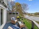 Amazing views everyday! Exterior balcony featuring a clear glass railing, a privacy lattice panel, and a sliding glass door - 245 Bishop Street S Unit# 4, Cambridge, ON  - Outdoor With Deck Patio Veranda 