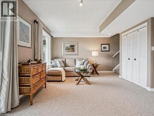 Carpeted living space with neutral wall tones and recessed lighting - 245 Bishop Street S Unit# 4, Cambridge, ON - Indoor