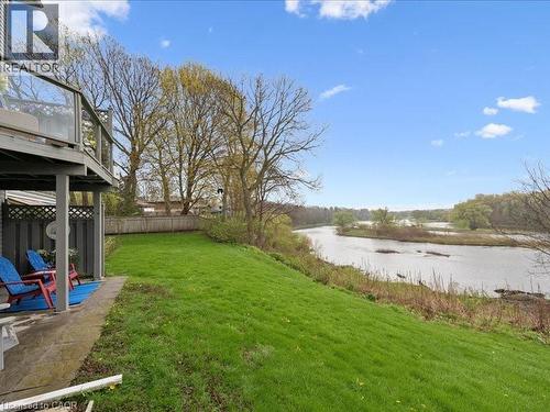 Expansive sloped lawn with a river backdrop - 245 Bishop Street S Unit# 4, Cambridge, ON - Outdoor