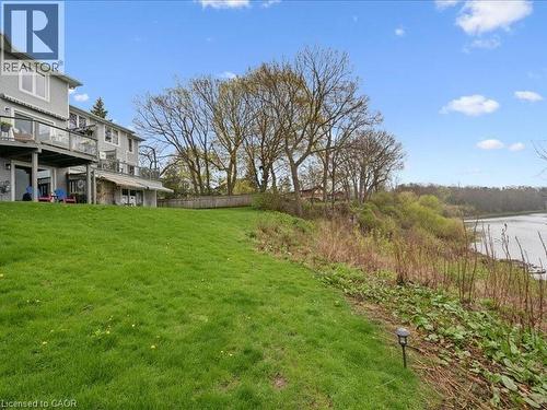 Expansive sloped lawn area leading to a naturalized embankment - 245 Bishop Street S Unit# 4, Cambridge, ON - Outdoor