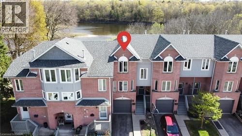 Brick and siding multi-level townhouse featuring a prominent bay window - 245 Bishop Street S Unit# 4, Cambridge, ON - Outdoor