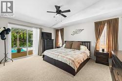 Primary Bedrooom with Patio Doors to Back Deck - 