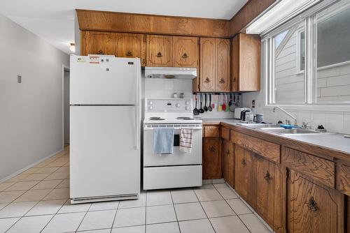 9732  75 Ave Nw, Edmonton, AB - Indoor Photo Showing Kitchen With Double Sink