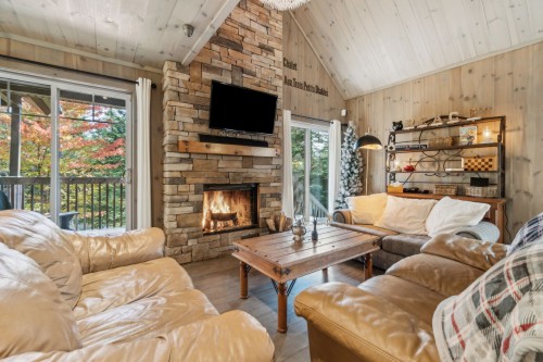 Living Room - 12 Imp. Du Chardonnet, Lac-Supérieur, QC - Indoor Photo Showing Living Room With Fireplace