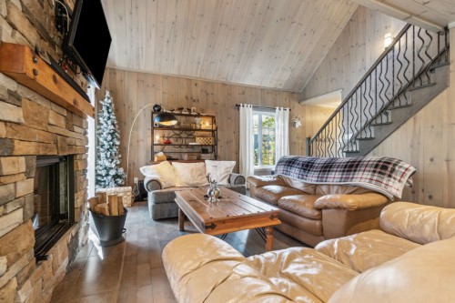 Living Room - 12 Imp. Du Chardonnet, Lac-Supérieur, QC - Indoor Photo Showing Living Room With Fireplace