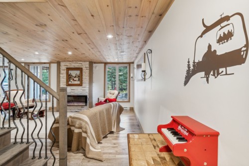 Family Room - 12 Imp. Du Chardonnet, Lac-Supérieur, QC - Indoor Photo Showing Other Room With Fireplace