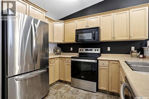 34 4425 Nicurity Drive, Regina, SK - Indoor Photo Showing Kitchen With Stainless Steel Kitchen With Double Sink
