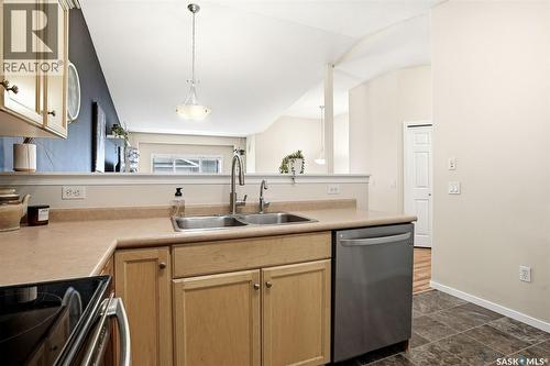 34 4425 Nicurity Drive, Regina, SK - Indoor Photo Showing Kitchen With Double Sink