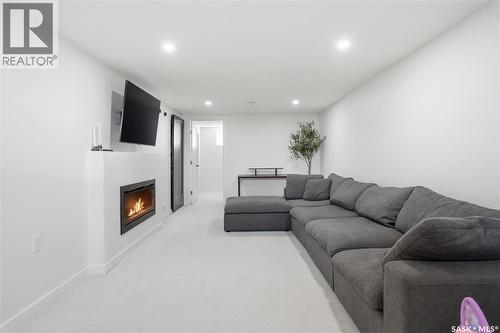 709 Inver Crescent E, Regina, SK - Indoor Photo Showing Living Room With Fireplace