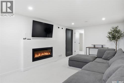 709 Inver Crescent E, Regina, SK - Indoor Photo Showing Living Room With Fireplace