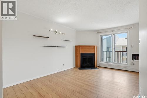 316B 4040 8Th Street E, Saskatoon, SK - Indoor Photo Showing Living Room With Fireplace