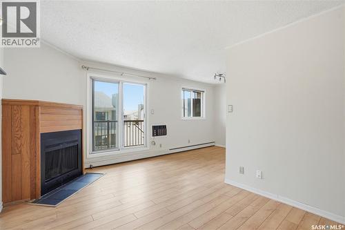 316B 4040 8Th Street E, Saskatoon, SK - Indoor Photo Showing Other Room With Fireplace