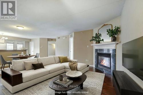212 - 4005 Kilmer Drive, Burlington (Tansley), ON - Indoor Photo Showing Living Room With Fireplace