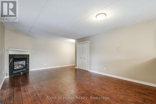 212 - 4005 Kilmer Drive, Burlington (Tansley), ON - Indoor Photo Showing Other Room With Fireplace