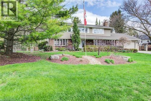Traditional two-story residence featuring a brick and siding exterior, bay windows, and an attached two-car garage - 514 Colonial Drive, Waterloo, ON - Outdoor